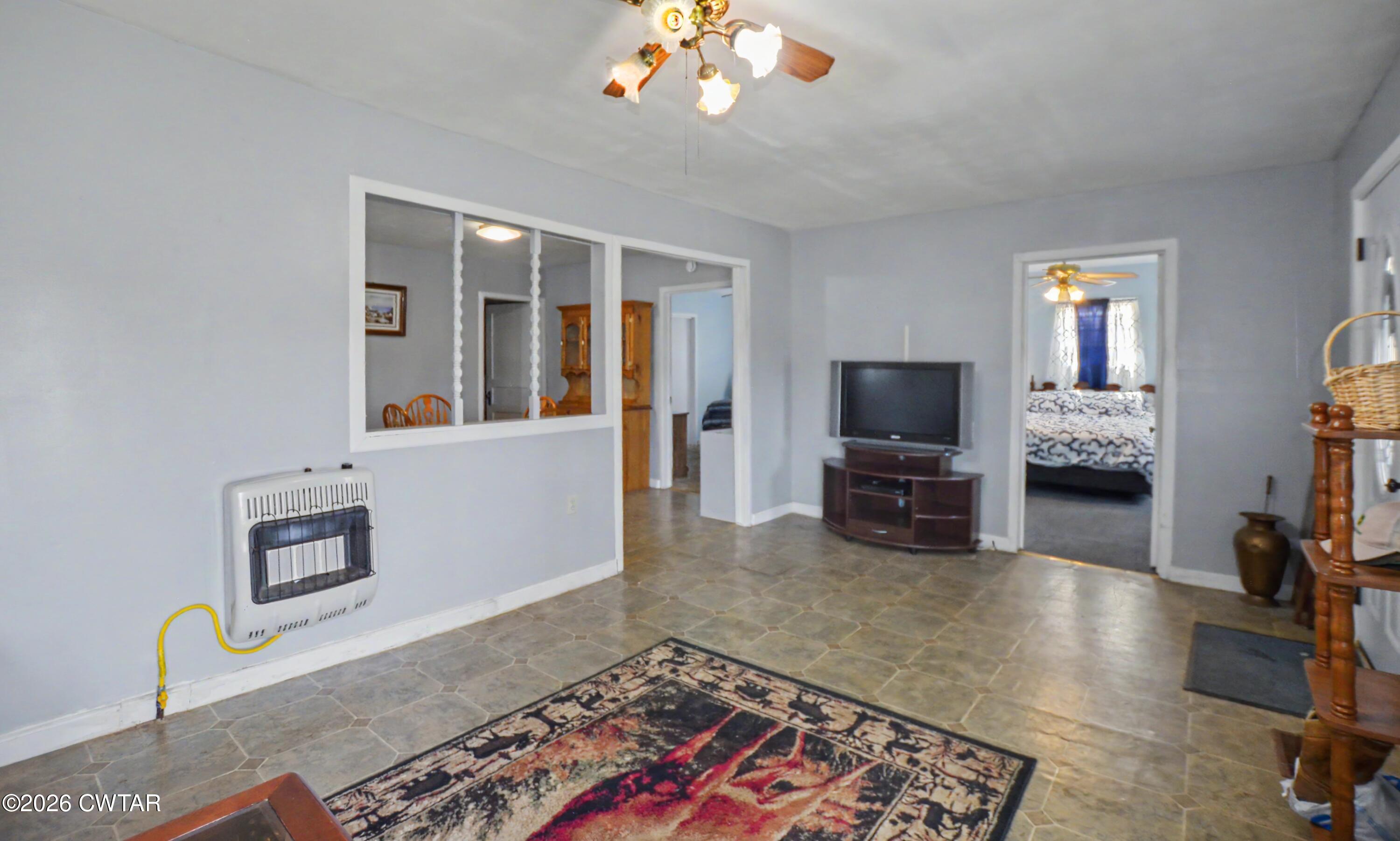 158 Depot Street Friendship, TN 38034 - Photo 8 of 16 a living room with furniture and a flat screen tv