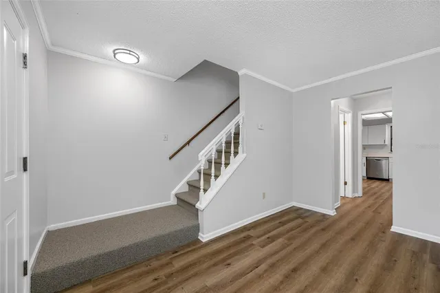a view of entryway with wooden floor