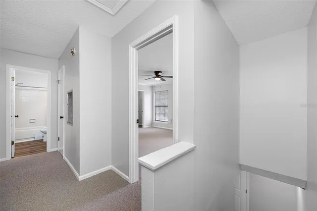 a en suite bathroom with a granite countertop sink and a mirror
