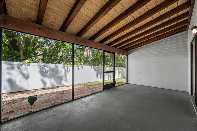 a view of an empty room with a balcony