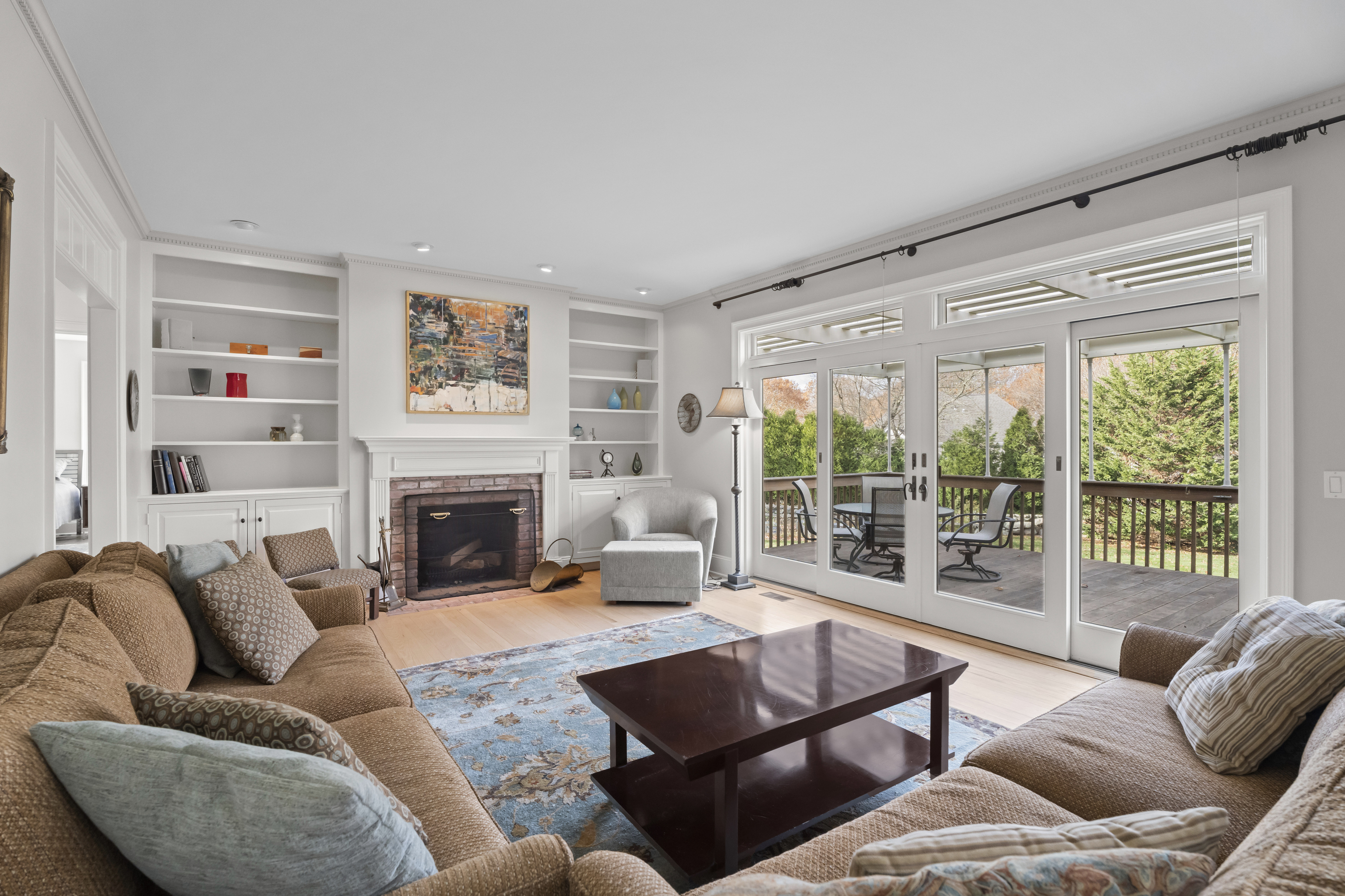 4 East Neck Road Stonington, CT 06378 - Photo 13 of 40 a living room with furniture fireplace and a large window