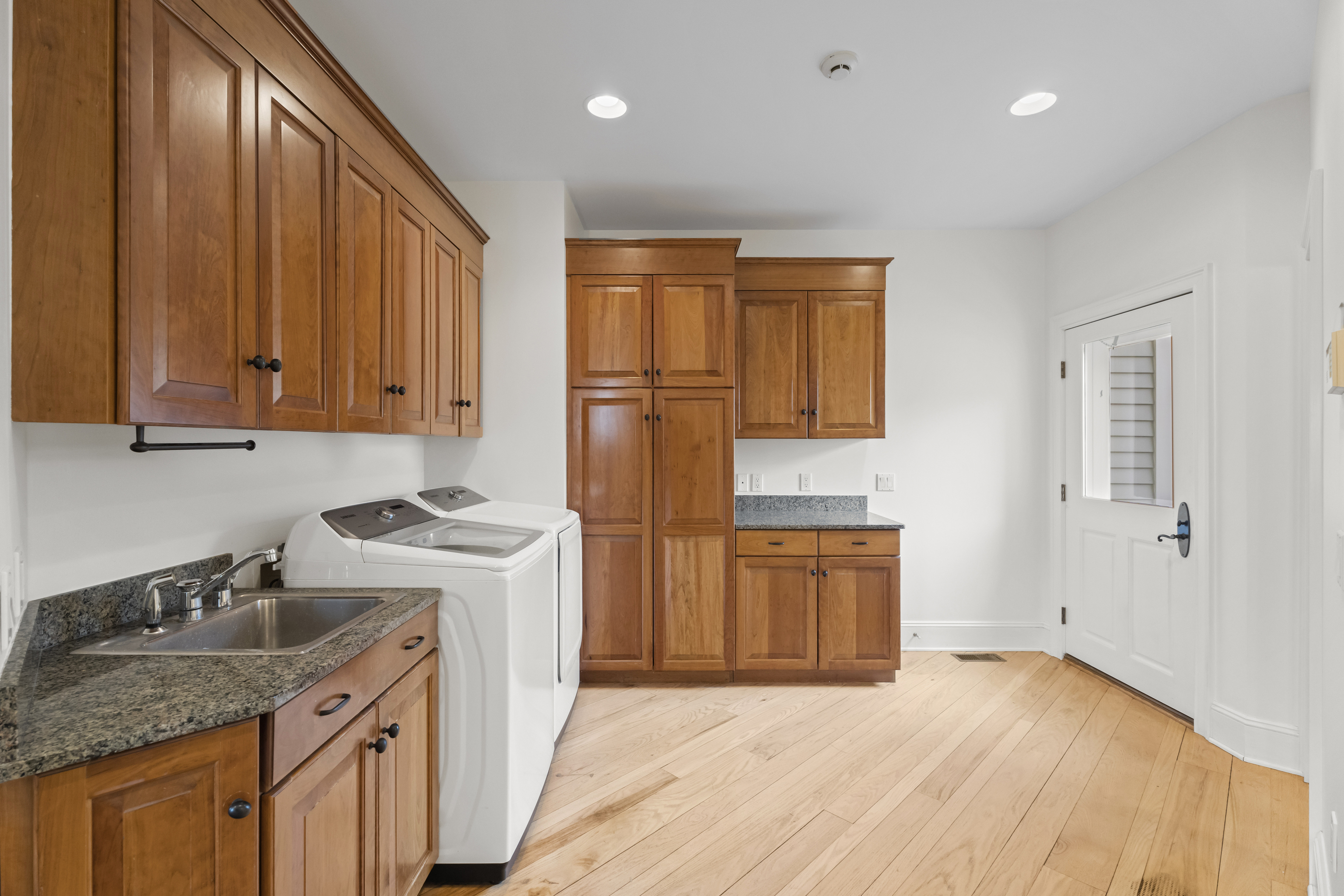 4 East Neck Road Stonington, CT 06378 - Photo 19 of 40 a kitchen with stainless steel appliances granite countertop a stove a sink and a refrigerator