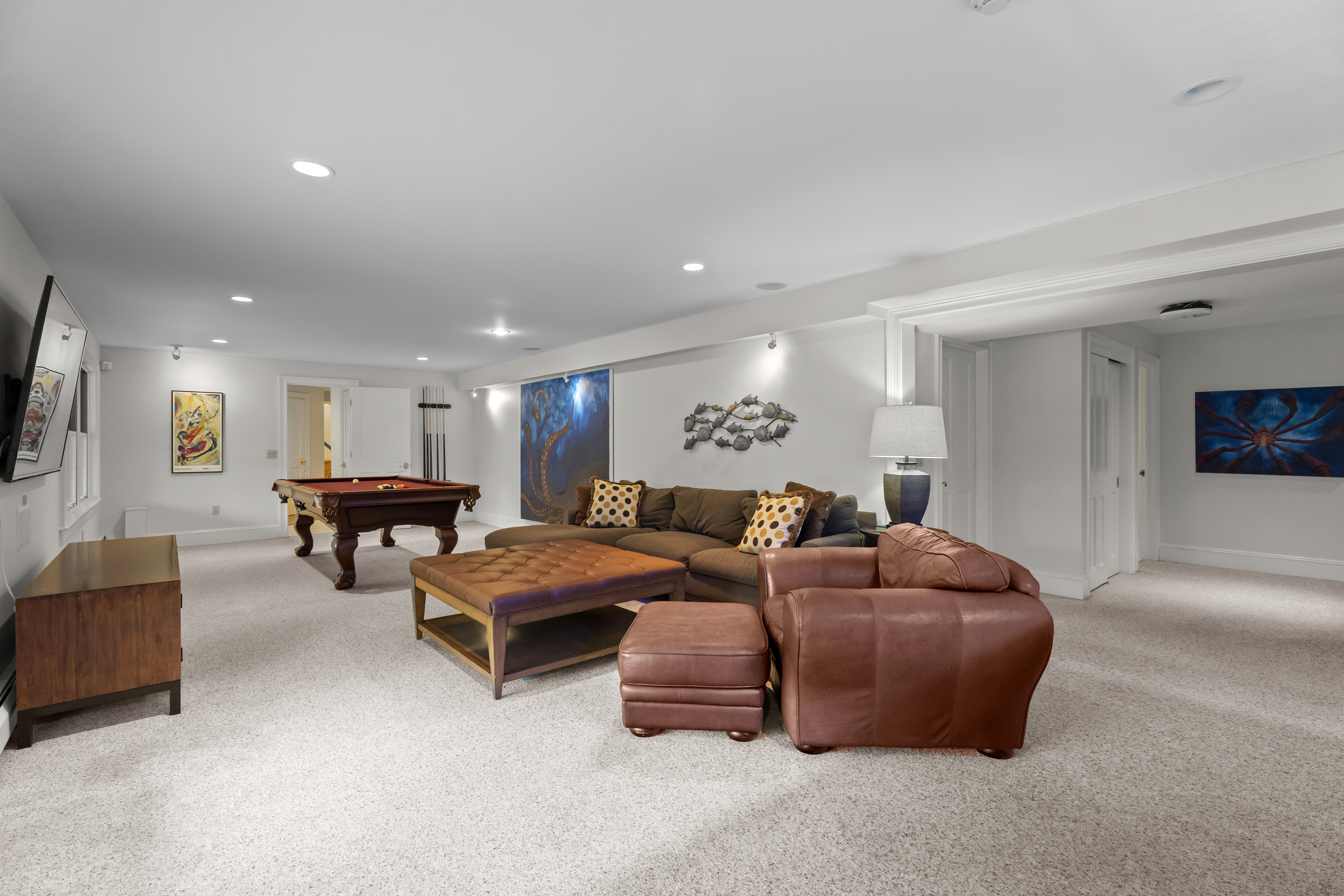 4 East Neck Road Stonington, CT 06378 - Photo 29 of 40 a living room with furniture and a flat screen tv