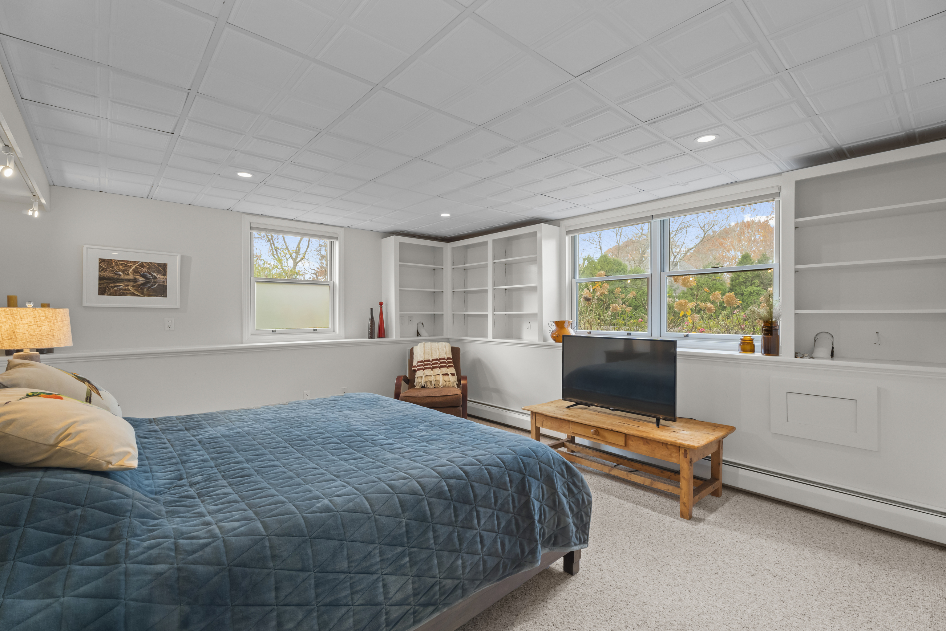 4 East Neck Road Stonington, CT 06378 - Photo 31 of 40 a bedroom with a bed and a large window