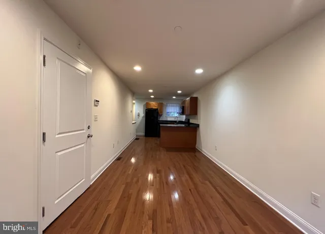 a view of kitchen with wooden floor