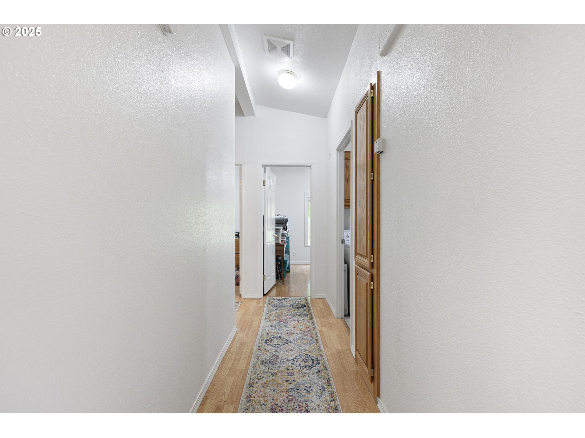 38716 Place Road Fall Creek, OR 97438 - Photo 20 of 48 a view of hallway with wooden floor
