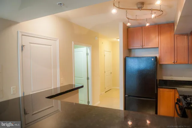 a white stove top oven sitting inside of a kitchen