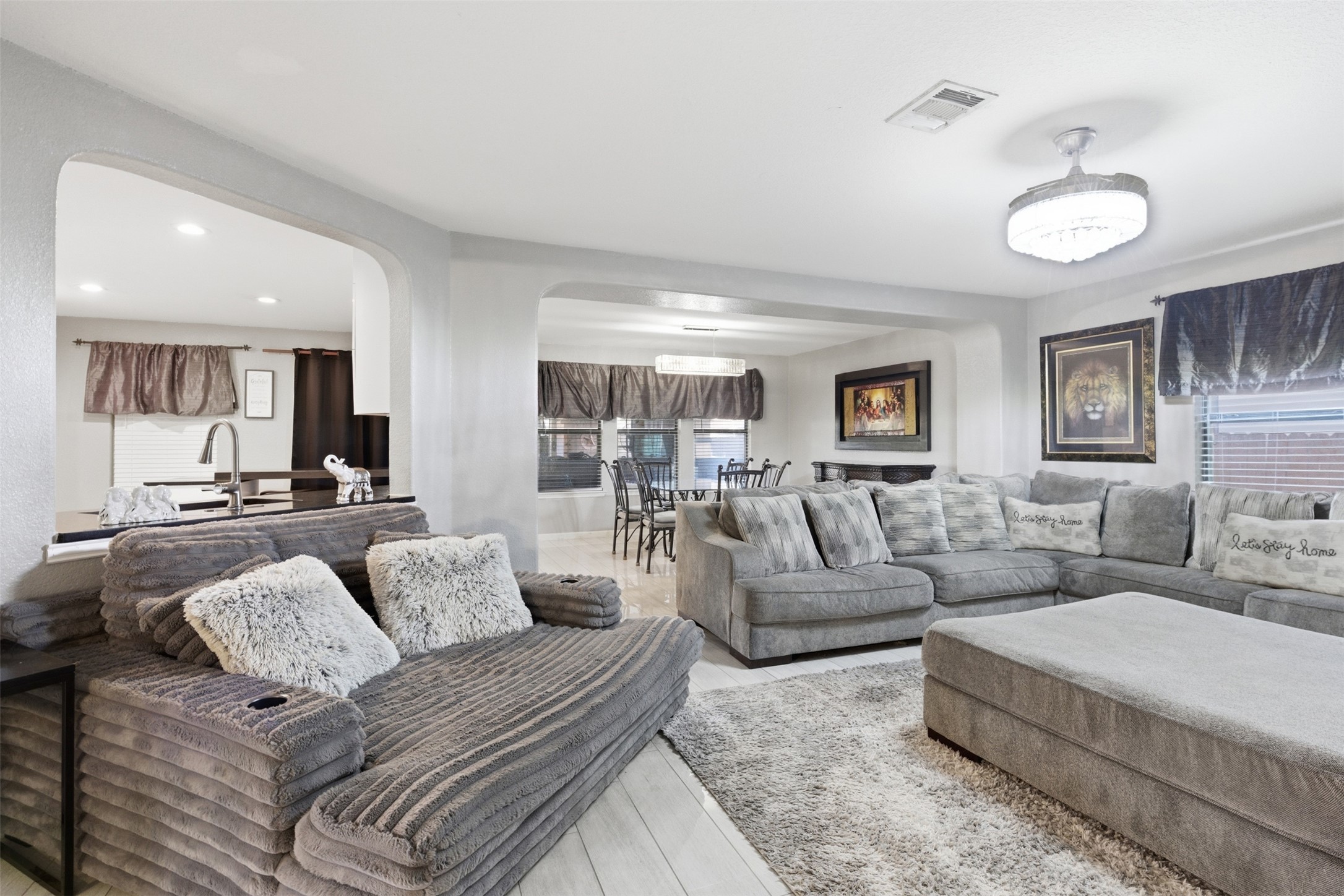 5701 Malarkey Road Del Valle, TX 78617 - Photo 11 of 27 Living area with arched walkways and recessed lighting