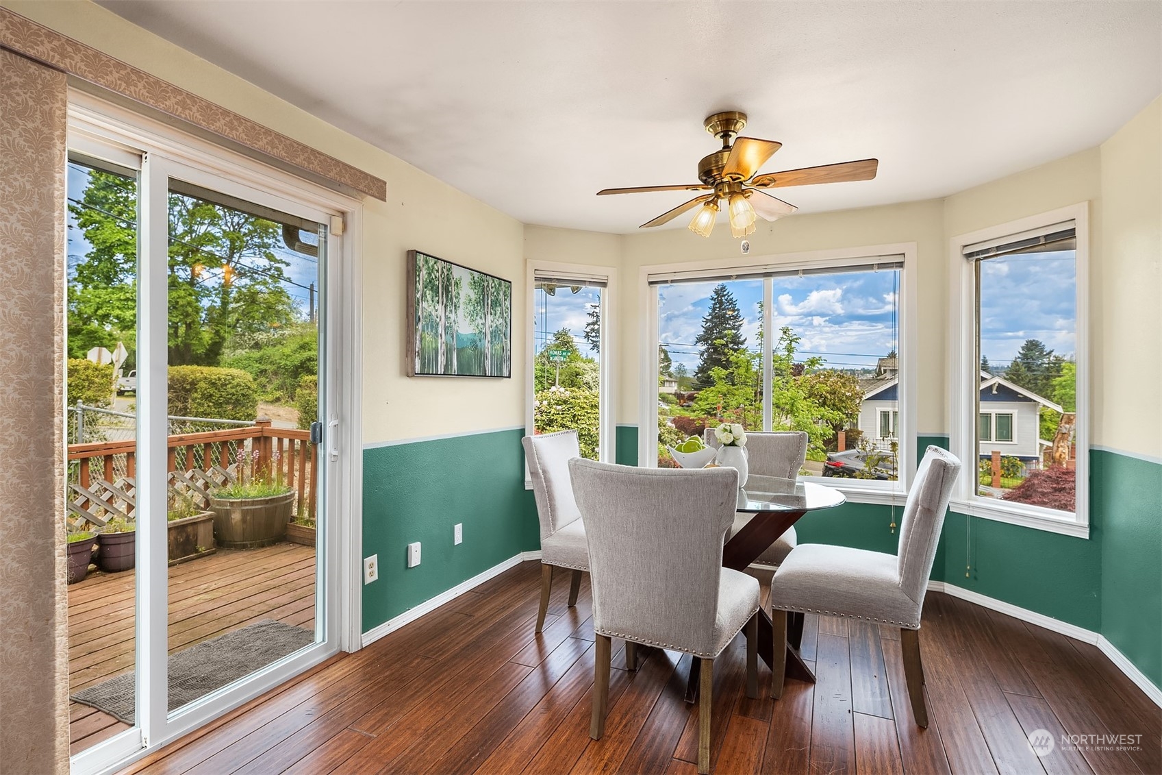 201 Thomas Avenue Southwest Renton, WA 98057 - Photo 11 of 38 a view of a dining room with furniture window and wooden floor