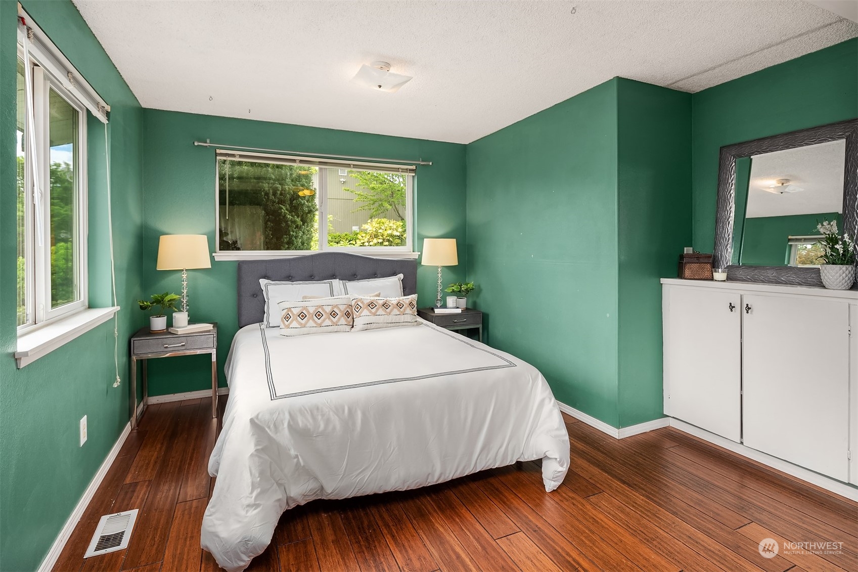 201 Thomas Avenue Southwest Renton, WA 98057 - Photo 14 of 38 a bedroom with a bed and a flat screen tv