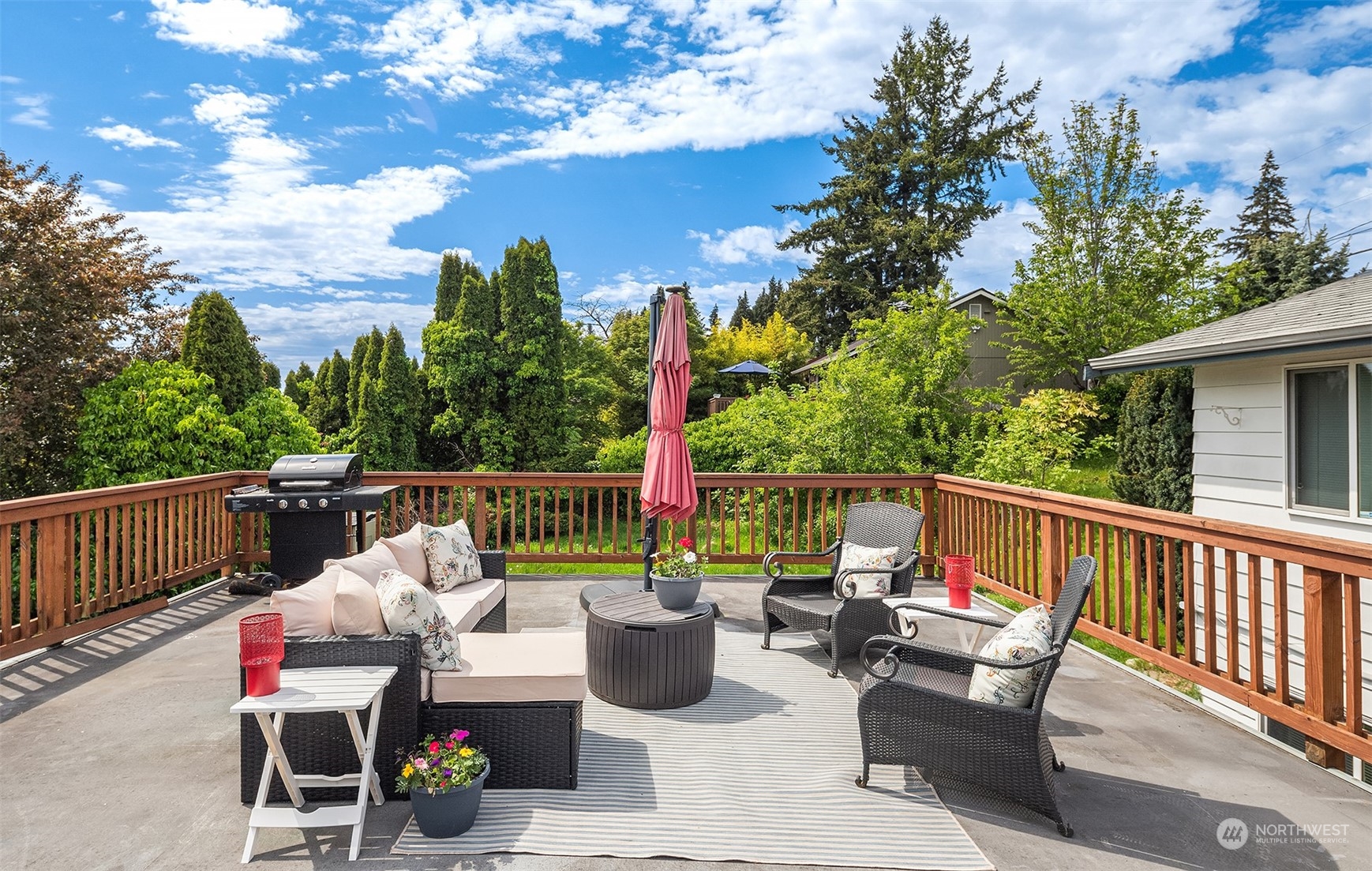 201 Thomas Avenue Southwest Renton, WA 98057 - Photo 27 of 38 a view of deck with furniture and trees