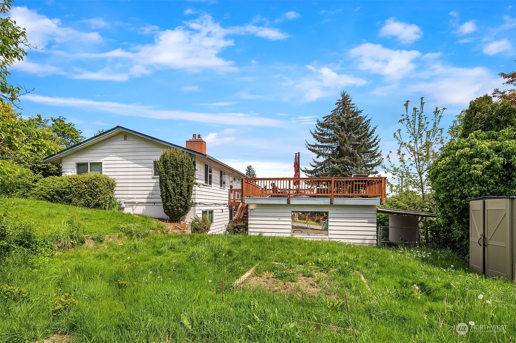 201 Thomas Avenue Southwest Renton, WA 98057 - Photo 30 of 38 a view of a backyard with plants and a garden
