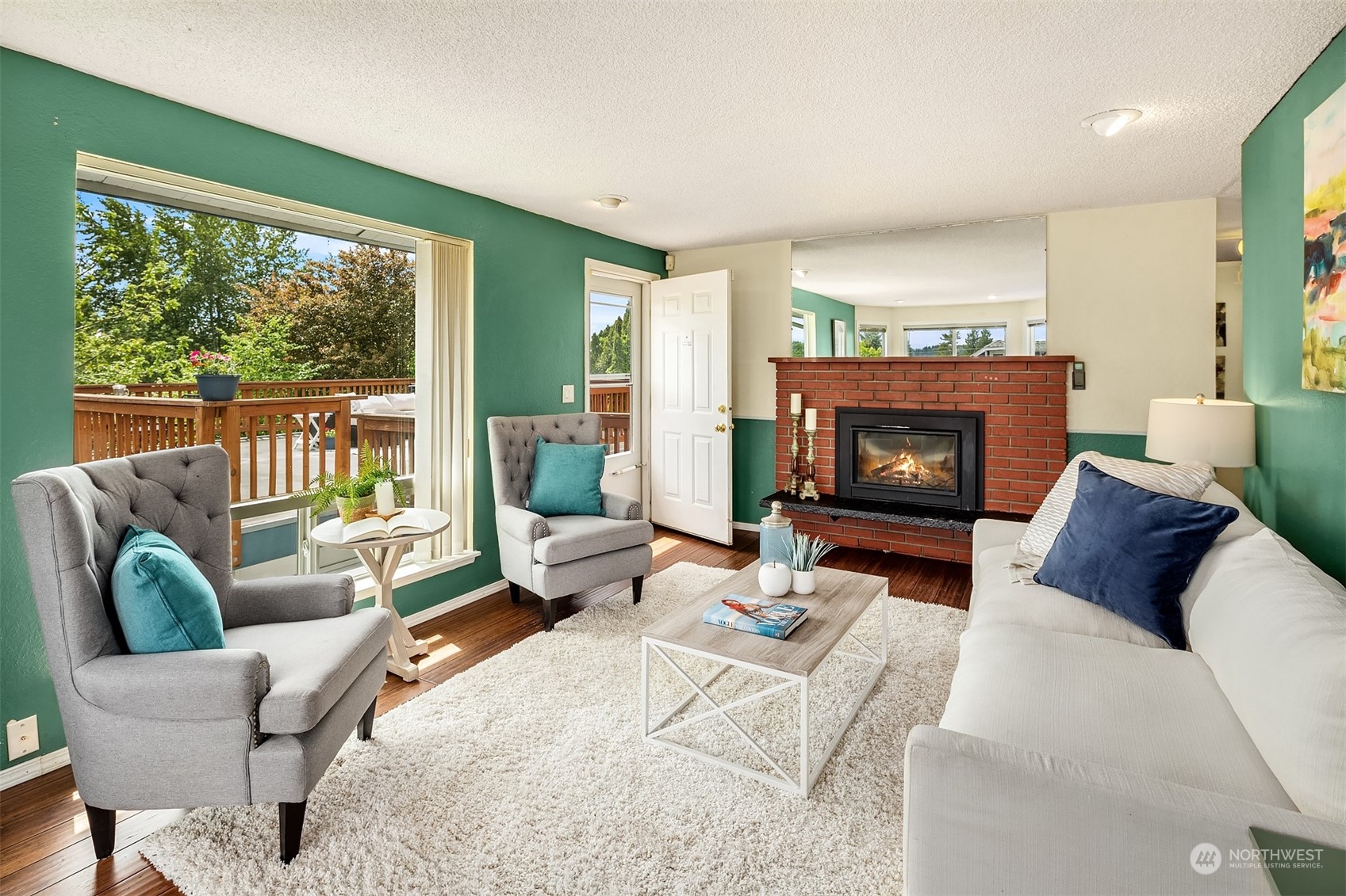 201 Thomas Avenue Southwest Renton, WA 98057 - Photo 4 of 38 a living room with furniture a fireplace and a large window