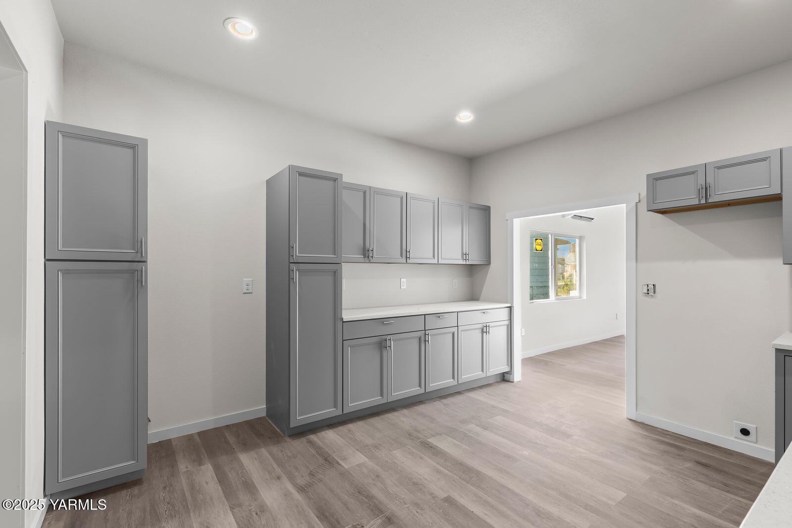 711 North 3rd Street Yakima, WA 98901 - Photo 21 of 21 a kitchen with a refrigerator sink and cabinets