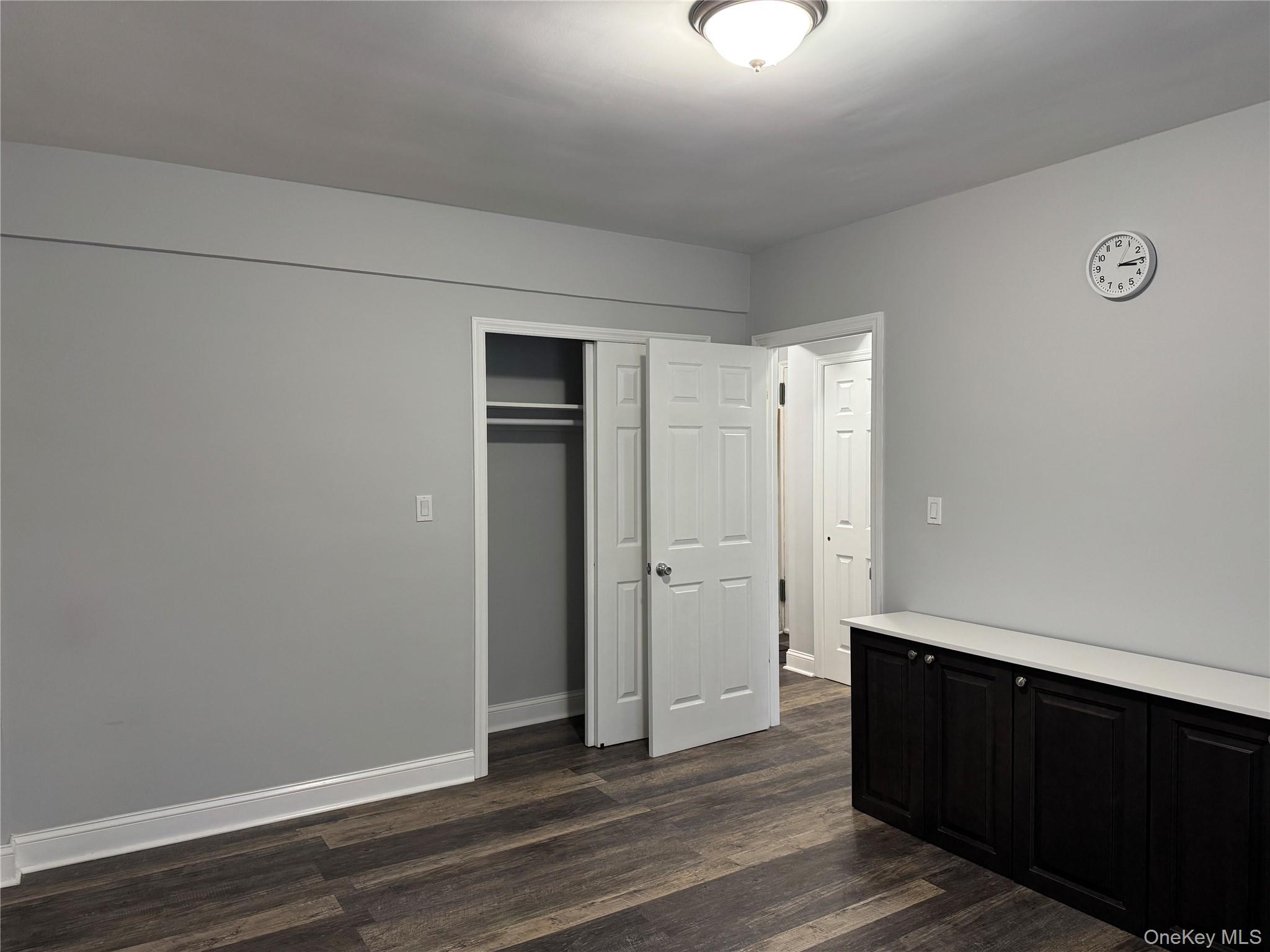 141-12 78th Avenue, Unit 1G Queens, NY 11367 - Photo 12 of 16 a view of an empty room with wooden floor