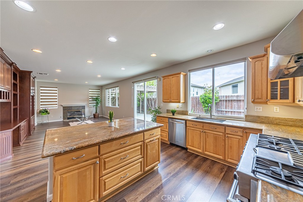 17645 Loganberry Road Carson, CA 90746 - Photo 11 of 56 a kitchen with stainless steel appliances granite countertop sink stove top oven and cabinets