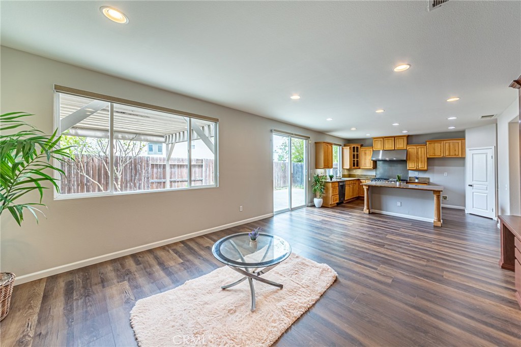 17645 Loganberry Road Carson, CA 90746 - Photo 5 of 56 a living room with furniture and a wooden floor