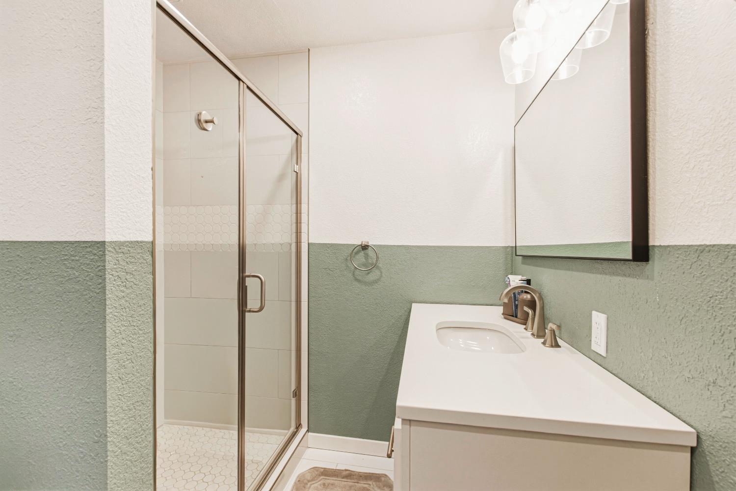 1908 Chelwood Way Modesto, CA 95355 - Photo 23 of 32 a bathroom with a sink and a mirror