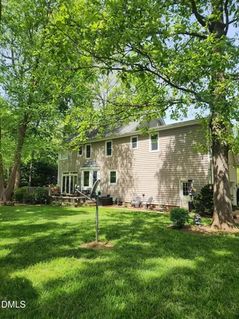 a view of a park that has large trees