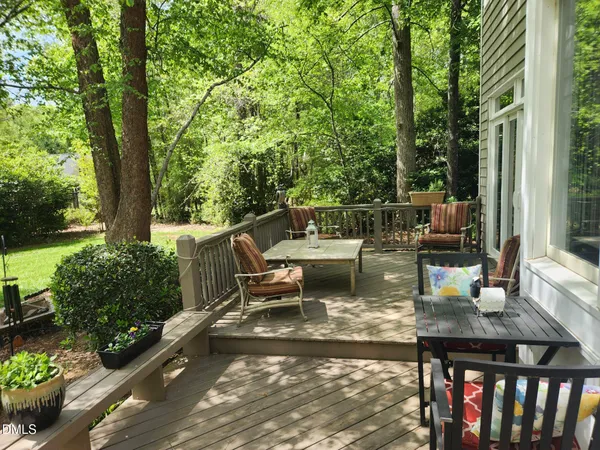 an aerial view of a house with a yard and trees