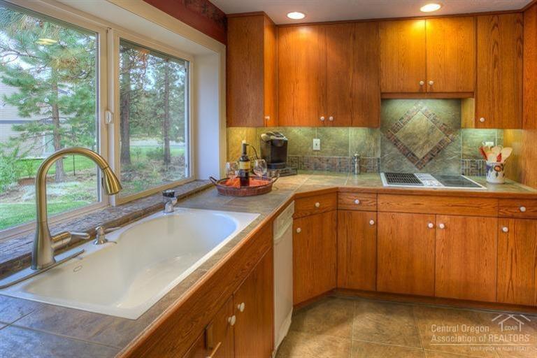 60192 West Ridgeview Drive Bend, OR 97702 - Photo 8 of 25 a kitchen with a sink and a window