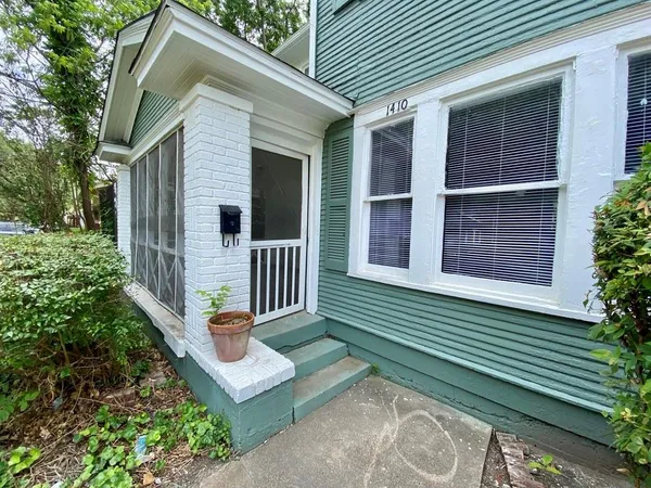 a front view of a house with a porch