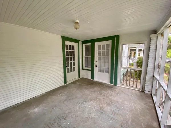a view of an empty room with a balcony