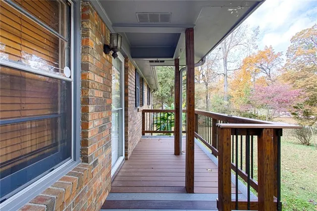 a view of a balcony with wooden floor