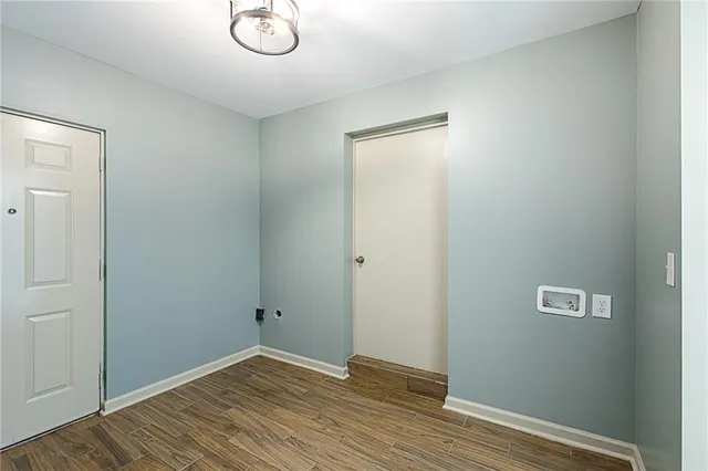 a view of room with wooden floor