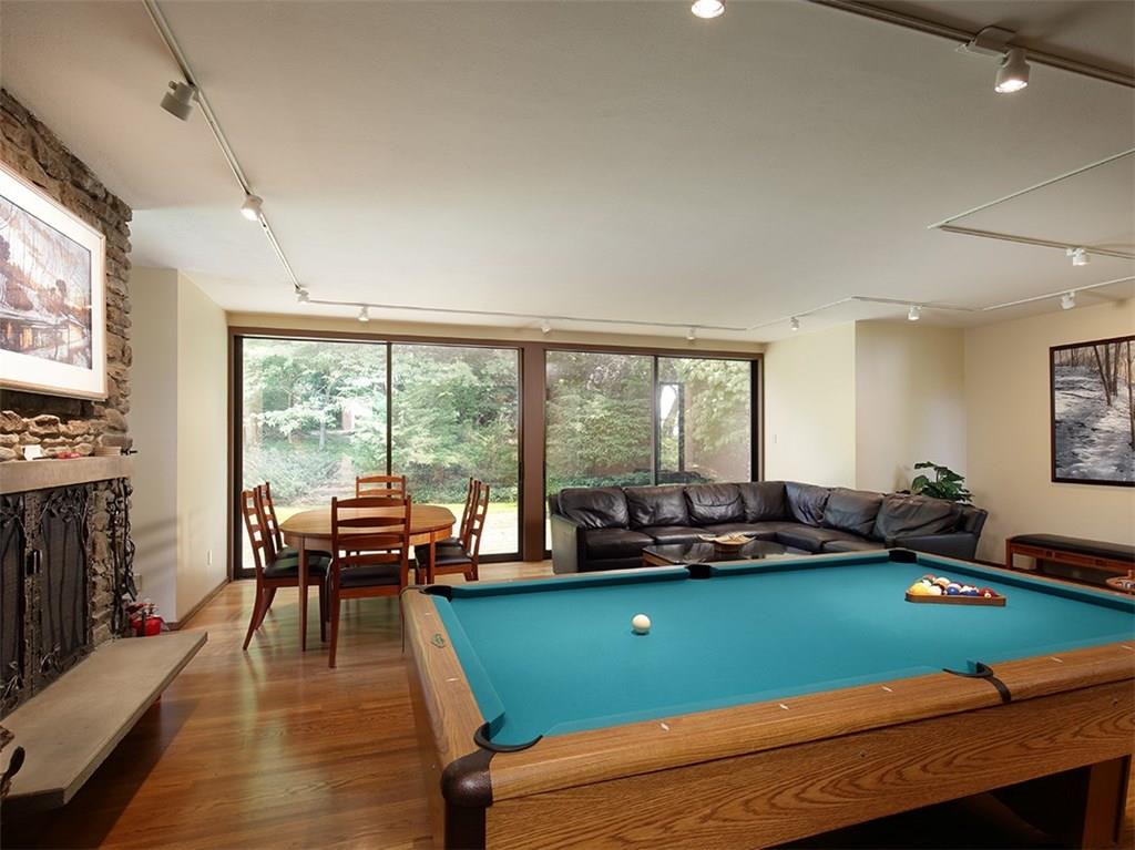 305 Country Club Road Rector, PA 15677 - Photo 14 of 25 The large family room with built in wet bar and double sliding doors to a patio and the pool too. Also has a fireplace!