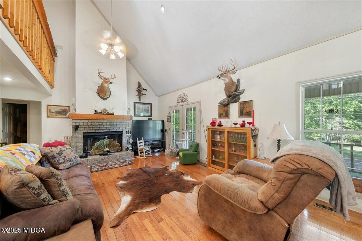 856 Lite-N-Tie Road Macon, GA 31211 - Photo 5 of 45 a living room with furniture a fireplace and a large window