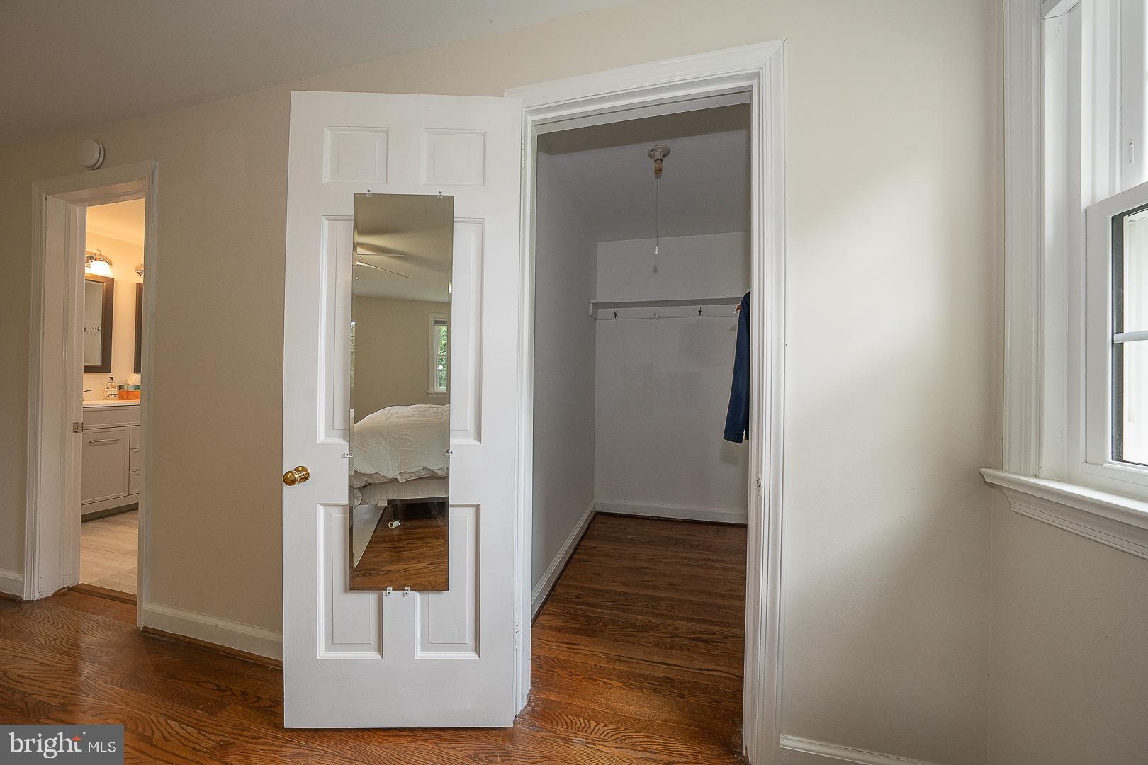 538 Conestoga Road Villanova, PA 19085 - Photo 20 of 39 a view of a hallway with wooden floor and a living room