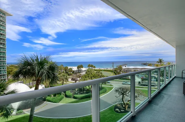 a view of balcony with furniture