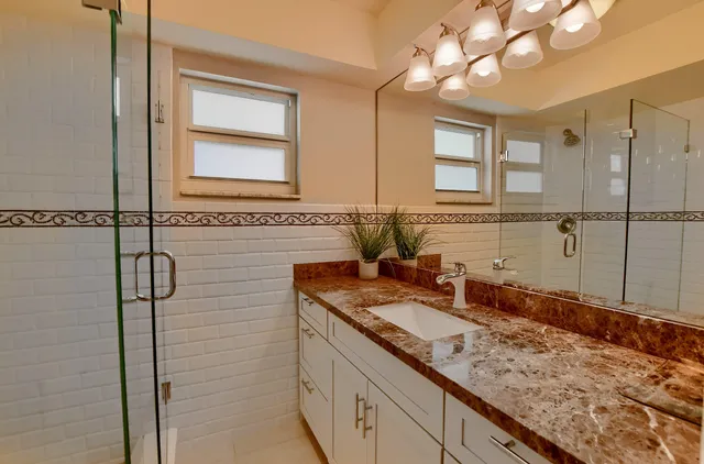 an aerial view of a house with a swimming pool