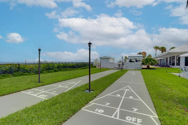 a view of a backyard and swimming pool