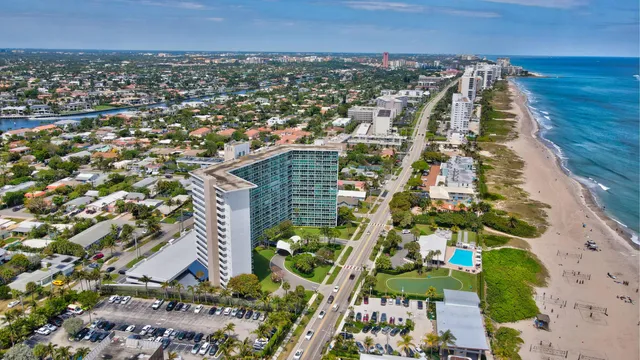 a view of a backyard with sitting area