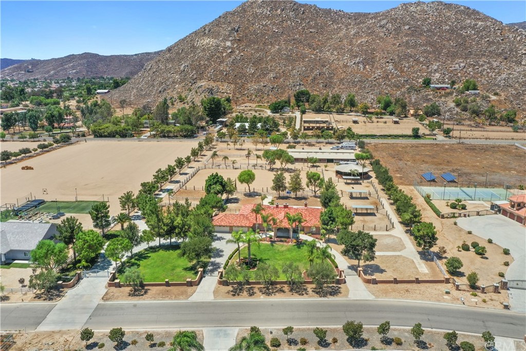 an aerial view of residential houses with outdoor space