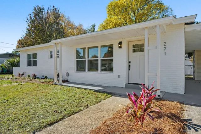 a kitchen with cabinets and stainless steel appliances