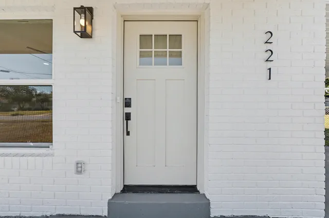 a kitchen with white cabinets