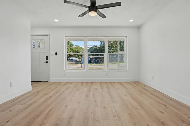 a bathroom with a toilet tub and shower