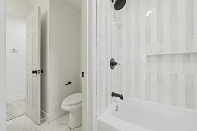 a view of an empty room with a large window