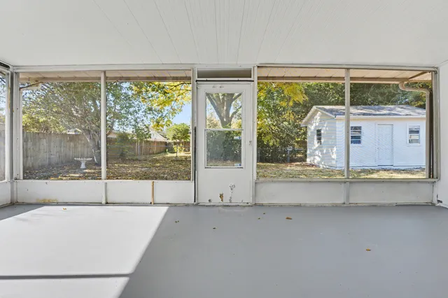 a view of a backyard of the house