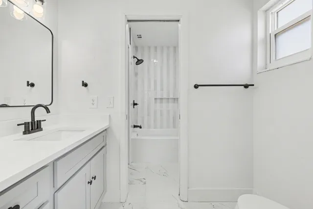 a backyard of house with large trees