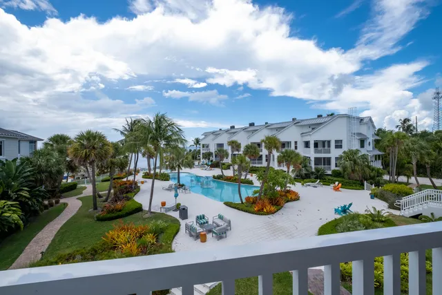 a group of people sitting in a kitchen