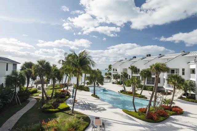 a view of a swimming pool with a patio