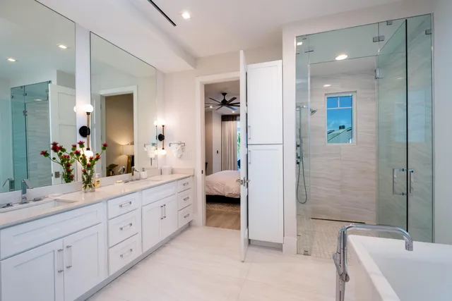 a white bath tub sitting next to a white toilet