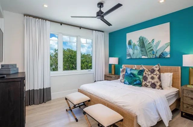 a bedroom with a bed and a television