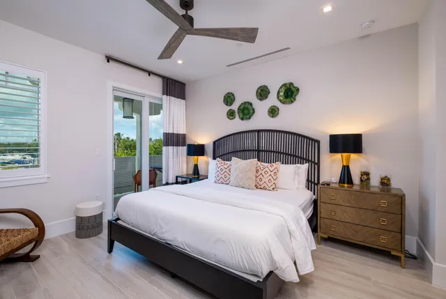 a bathroom with a shower a sink a toilet and a mirror