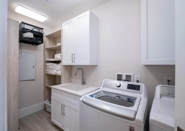 a spacious bedroom with a bed and furniture