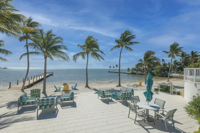 a view of a swimming pool with a table and chairs